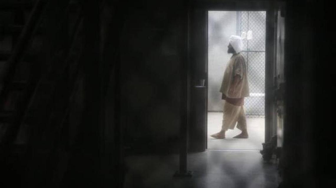 A cooperative captive paced inside a communal cellblock at Camp 6, at the U.S. Navy base at Guantánamo Bay, Cuba, in February. The photo was approved for release by the U.S. military.