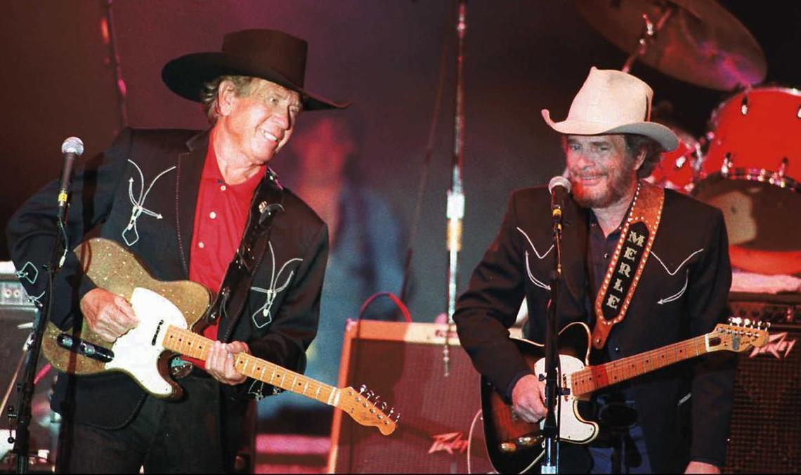 Country music legends Buck Owens (left) and Merle Haggard perform together on Friday, June 16, 1995, for the first time in thirty years at a concert in Bakersfield, California, the town in which they launched their careers. In the mid 1960s, Haggard played in Owens’ band before both went on to country music stardom.