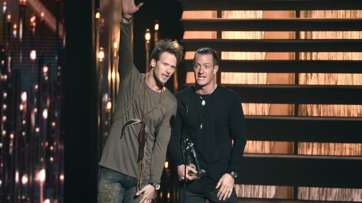 Brian Kelley, left, and Tyler Hubbard, of Florida Georgia Line, accept the award for vocal duo of the year at the 49th annual CMA Awards at the Bridgestone Arena on Wednesday, Nov. 4, 2015, in Nashville, Tenn.