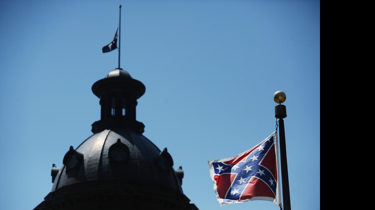 
The Confederate flag flies near the South Carolina Statehouse, Friday, June 19, 2015, in Columbia, S.C. 
