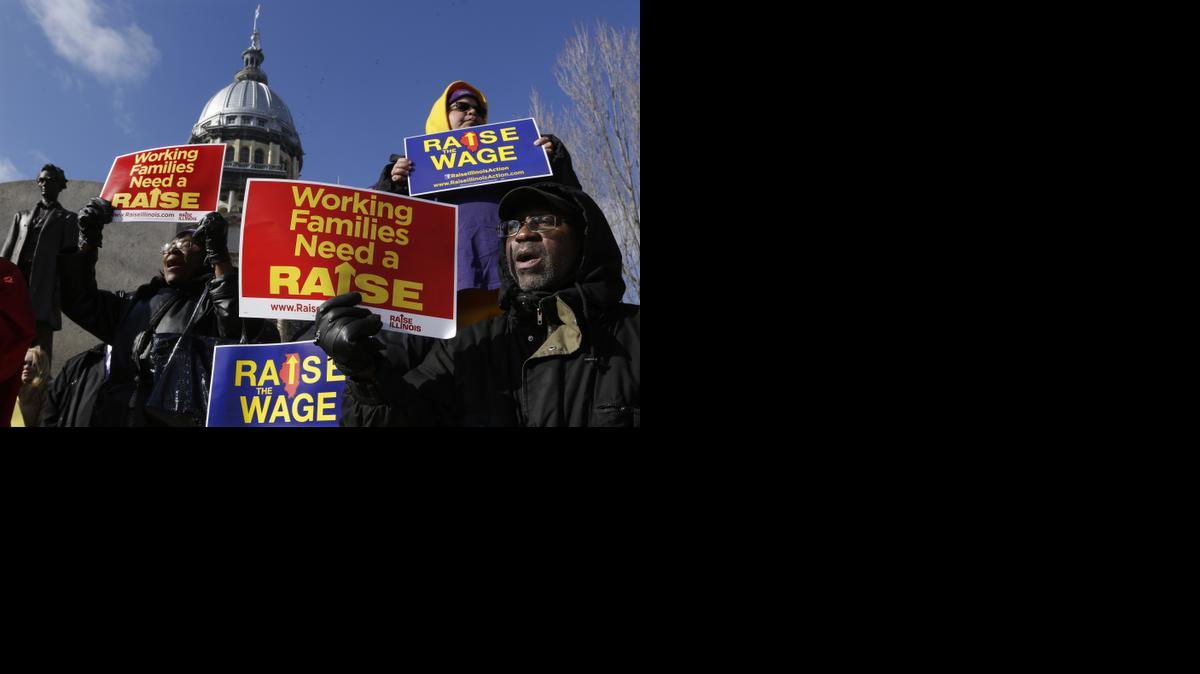 
In this Nov. 20, 2014, photo, supporters of legislation that will raise the minimum wage in Illinois rally outside the Illinois State Capitol in Springfield Ill. 
