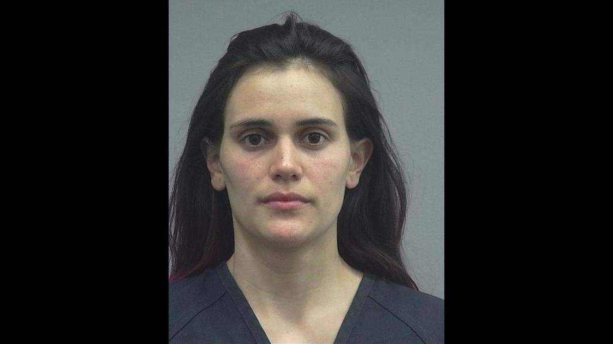 Lorena Margarita Montealegre's booking photo. The Gainesville woman was charged by Alachua County Sheriff's Department with two counts of battery on a law enforcement officer, burglary, grand theft and resisting arrest with violence on April 9, 2018.