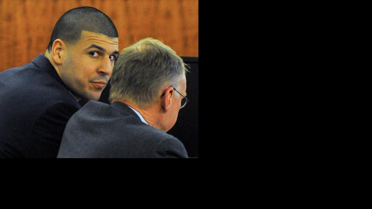 
Former New England Patriots football player Aaron Hernandez, left, sits with his attorney, Charles Rankin, during his trial on Monday, April 13, 2015. in Fall River, Mass. Hernandez is accused of killing Odin Lloyd in June 2013. 
