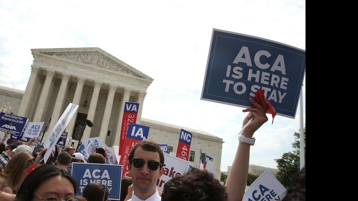 
People celebrate in front of the US Supreme Court after ruling was announced on the Affordable Care Act. June 25, 2015 in Washington, DC. The high court ruled that the Affordabvle Care Act may provide nationwide tax subsidies to help poor and middle-class people buy health insurance.
