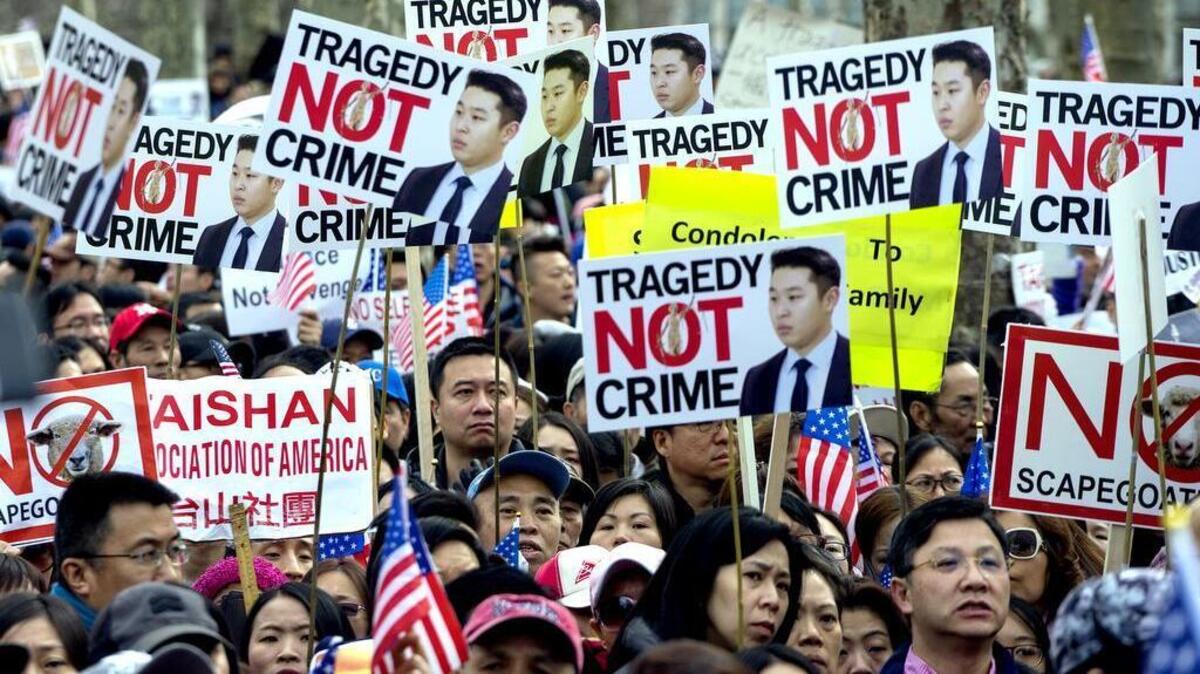Protesters attend a rally in the Brooklyn borough of New York Feb. 20, 2016, in support of former NYPD police officer Peter Liang, who was convicted of manslaughter for the 2014 shooting death of Akai Gurley, in a housing project stairwell.