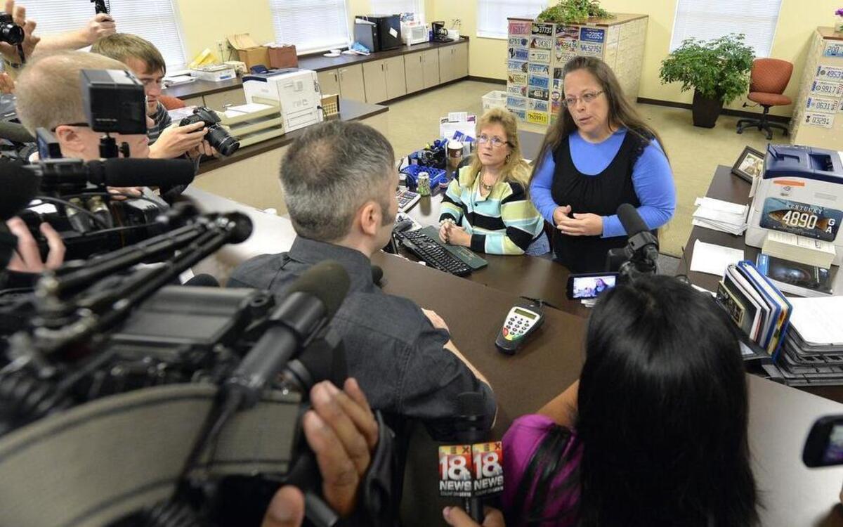 
Rowan County Clerk Kim Davis, right, talks with David Moore following her office's refusal to issue marriage licenses at the Rowan County Courthouse in Morehead, Ky., Tuesday, Sept. 1, 2015. Although her appeal to the U.S. Supreme Court was denied, Davis still refuses to issue marriage licenses. 
