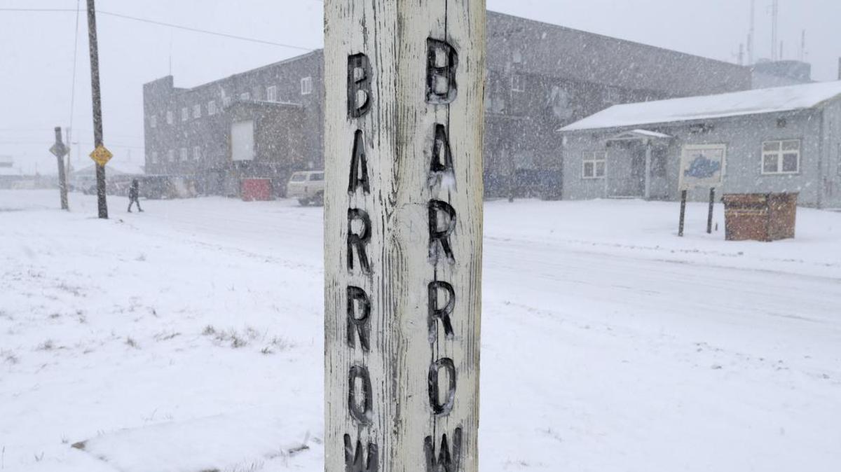 Snow falls around a sign in Barrow, Alaska, in 2014. Residents in Barrow, the nation's northernmost community, have voted to change the name of their city back to its traditional Inupiat name of Utqiagvik.