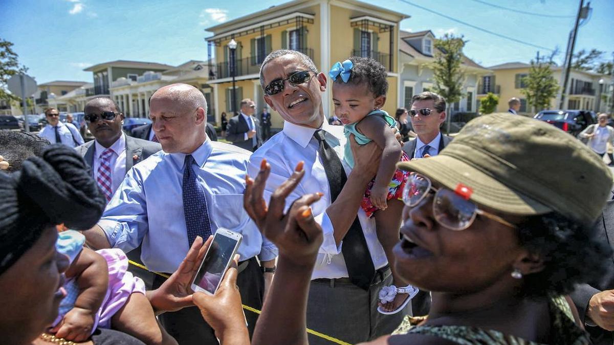 
President Barack Obama and Mayor Mitch Landrieu, left, tour the Yvonne Marrero Commons, built on the site of the notoriously dilapidated former B.W. Cooper housing complex in New Orleans, Aug. 27, 2015. Obama is touring recovery efforts 10 years after the devastation caused by Hurricane Katrina. 
