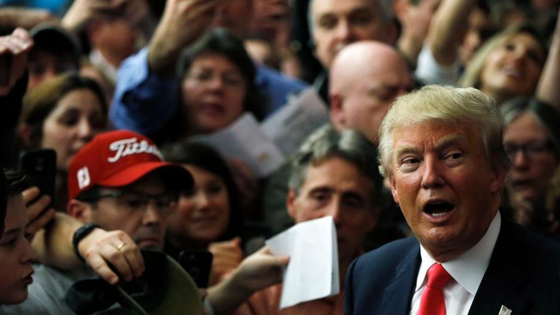 Republican presidential candidate Donald Trump meets with attendees during a campaign stop Tuesday, Feb. 2, 2016, in Milford, N.H.