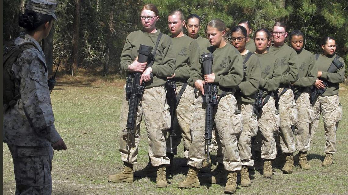 Female recruits stand at the Marine Corps Training Depot on Parris Island, S.C. New physical standards established so women can compete for combat posts in the Marine Corps have weeded out many of the female hopefuls. But data obtained by The Associated Press shows they’re also disqualifying some men.