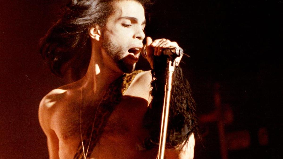 Prince performs a benefit concert for the family of Charles (Big Chick) Huntsberry in Minneapolis in 1990.