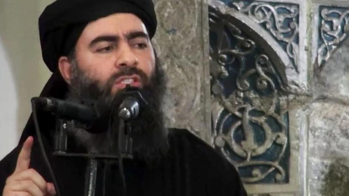 This file image made from video posted on a militant website Saturday, July 5, 2014, which has been authenticated based on its contents and other AP reporting, purports to show the leader of the Islamic State group, Abu Bakr al-Baghdadi, delivering a sermon at a mosque in Iraq during his first public appearance. An online image released Wednesday purported to show the Islamic State affiliate in Egypt had beheaded a Croatian hostage.