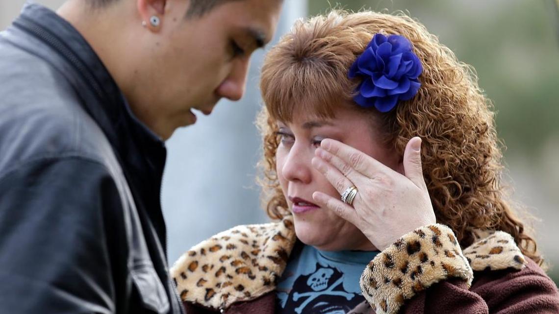 Lisa Gonzalez waited Thursday to return to her home, which police had cordoned off in the neighborhood where police shot it out with the suspects in Wednesday’s massacre in San Bernardino. The two suspects were killed. California lawmakers in Washington remain divided over what to do about gun violence.