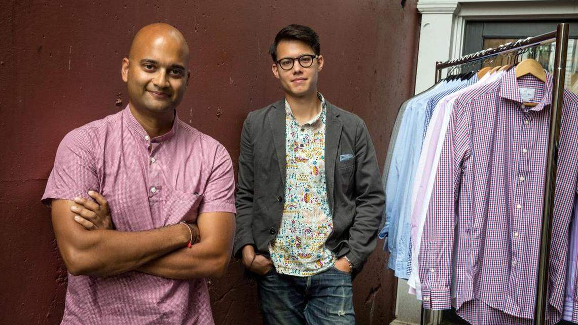 Pranav Vora, left, and Philip Soriano, the co-founders of Hugh & Crye, with a rack of their wares outside their Washington, D.C., office.