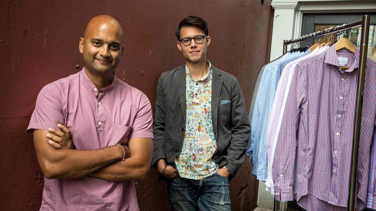 Pranav Vora, left, and Philip Soriano, the co-founders of Hugh & Crye, with a rack of their wares outside their Washington, D.C., office.