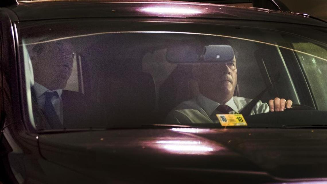 Former Trump Campaign Chairman Paul Manafort, left, leaves his home in Alexandria, Va., Monday, Oct. 30, 2017.