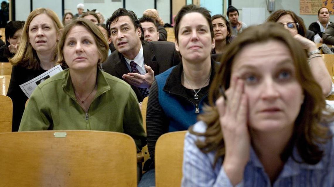 
 Parents watch projected results during an admissions lottery at Public School 84 in the Manhattan borough of New York on Feb. 13, 2007. Along with new options in the city’s school system are anxiety-ridden admissions procedures, an ordeal that in some ways rivals the quest for Ivy League colleges and in other ways is the educational equivalent of the annual bridal sale at Filene’s.

