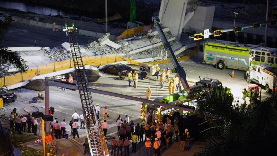 Recovery operations continue Friday evening, March 16, 2018, at the site of the collapse FIU pedestrian bridge.