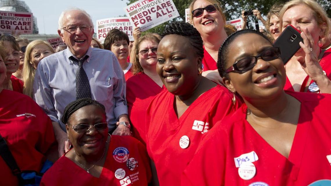 
Democratic presidential candidate, Sen. Bernie Sanders, I-Vt., poses with a group of nurses after speaking at a rally on the 50th anniversary of Medicare and Medicaid, July 30, 2015, on Capitol Hill in Washington. 
