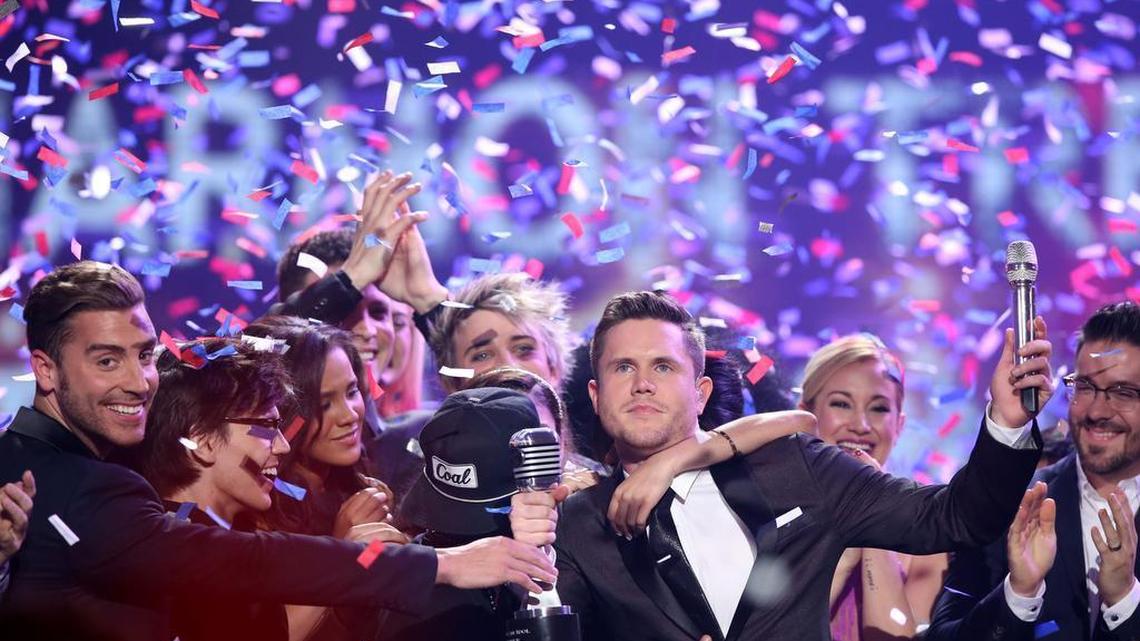 Trent Harmon, center, winner of "American Idol" The Farewell Season celebrates with fellow contestants during the season finale Thursday in Los Angeles.