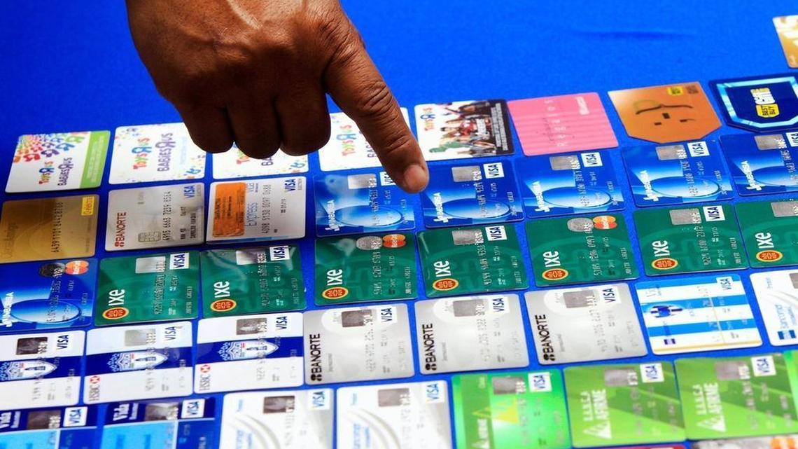 
In this file photo from last year, McAllen, Texas, Police Chief Victor Rodriguez points at dozens of fraudulent credit cards that were confiscated after arresting a man and a woman on fraud charges tied to the 2014 credit card breach at Target.
