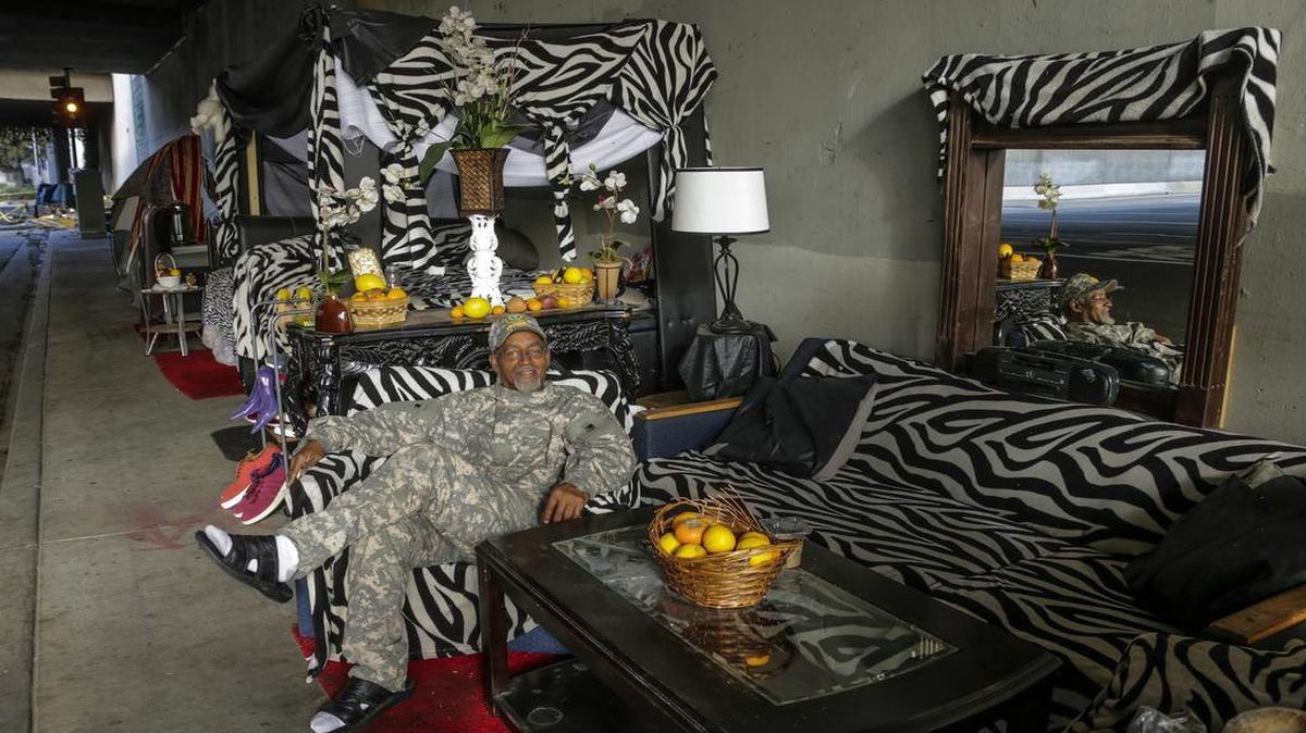 Ceola Waddell Jr., a homeless man whose street name is Mr. Dice, has recreated a very elaborate apartment life on 39th Street underneath Freeway 110 and calls it “Paradise Lane,” shown Nov. 12, 2016 in Los Angeles.