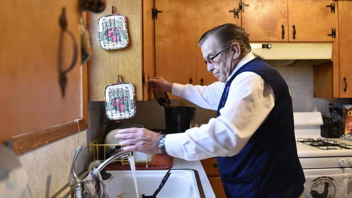 Tom Coomer makes a pot of coffee at his home in Wagoner, Oklahoma, after a day of work at Walmart.