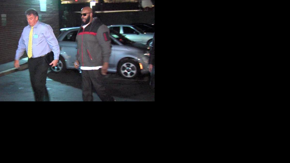 
This image from video shows Death Row Records founder Marion “Suge” Knight, right, walking into the Los Angeles County Sheriff’s department early Friday morning Jan. 30, 2015, in connection with a hit-and-run incident that left one man dead and another injured. 
