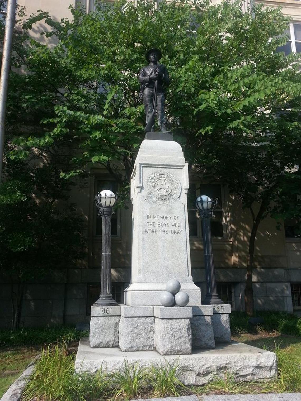 Protesters pulled down this 15-foot-tall statue of a Confederate soldier Monday night, Aug. 14, 2017, on East Main Street in downtown Durham. Durham citizens erected and dedicated the statue on May 10, 1924, in memory of “the boys who wore the gray.”