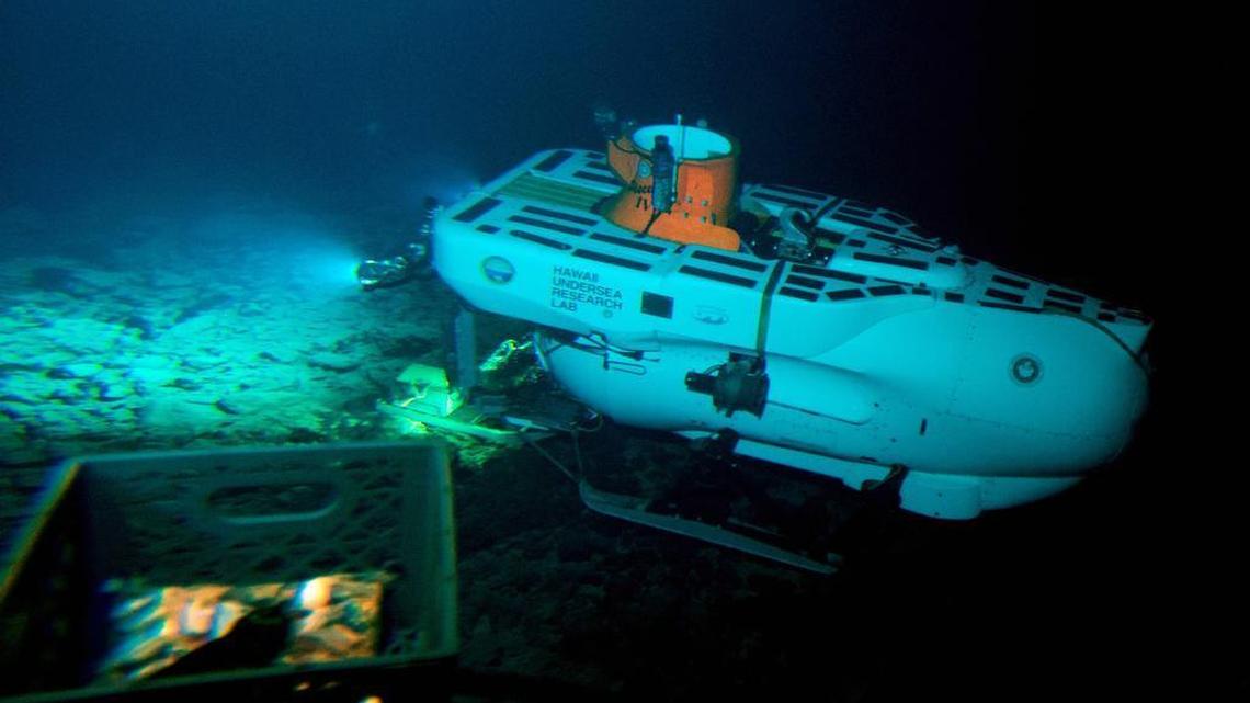 The Pisces IV submersible sits atop the summit of Cook seamount, as seen from the Pisces V craft, during a dive to the previously unexplored underwater volcano off the coast of Hawaii's Big Island on Sept. 6, 2016.
