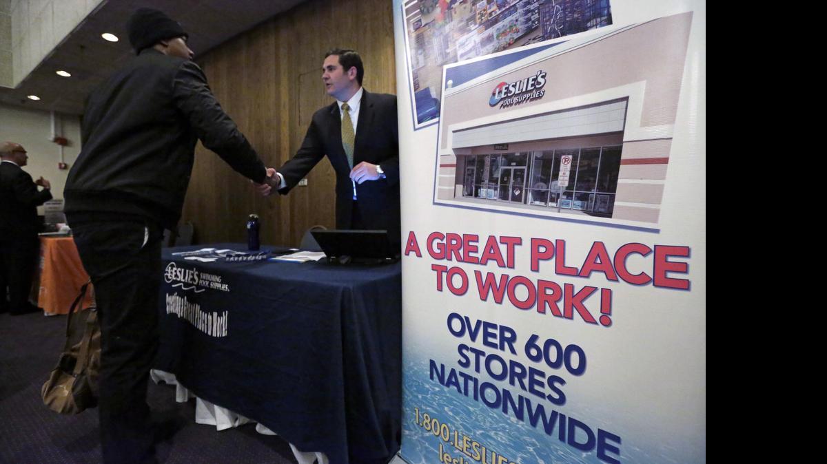 
A sign at a recruiting station for Leslie's Pool supplies in April boasts that it is a great place to work during a National Career Fairs job fair, in Chicago. 
