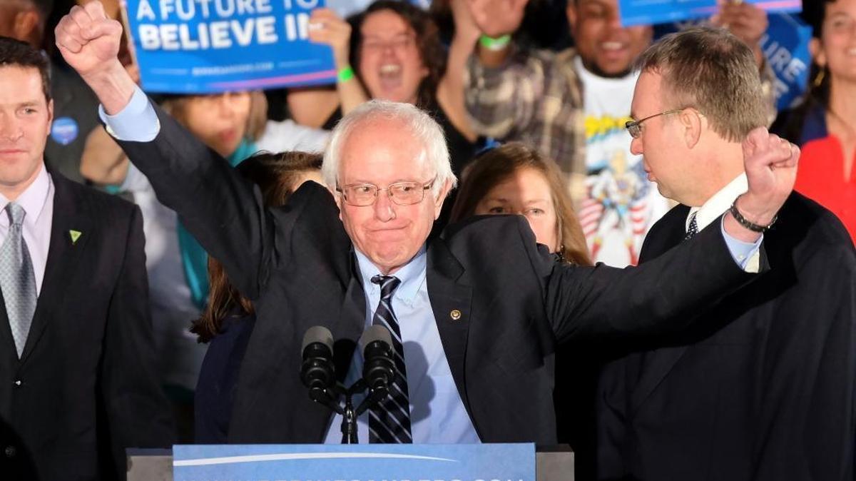 Democratic presidential candidate, Sen. Bernie Sanders, I-Vt., reacts to the cheering crowd at his primary night rally Tuesday, Feb. 9, 2016, in Manchester, N.H.