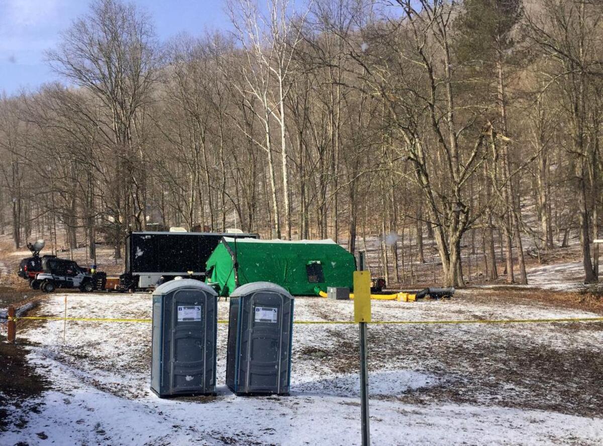 In this March 13, 2018 photo, FBI agents and representatives of the Department of Conservation and Natural Resources set up a base off of Route 555 Benezette Township, Elk County, Pa., while conducting a search of Civil War era gold rumored to have been lost here.