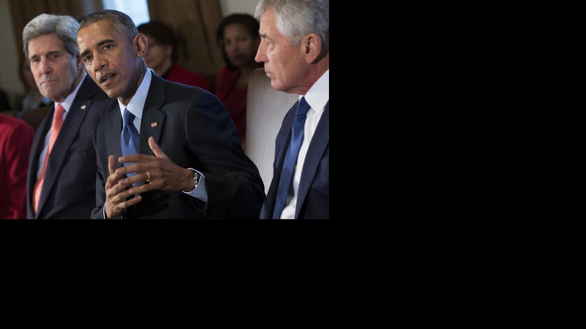 
Secretary of State John Kerry, left, and Secretary of Defense Chuck Hagel, right, look on as President Barack Obama delivers remarks on his budget proposal during a cabinet meeting in the Cabinet Room of the White House, on Tuesday, Feb. 3, 2015, in Washington. 
