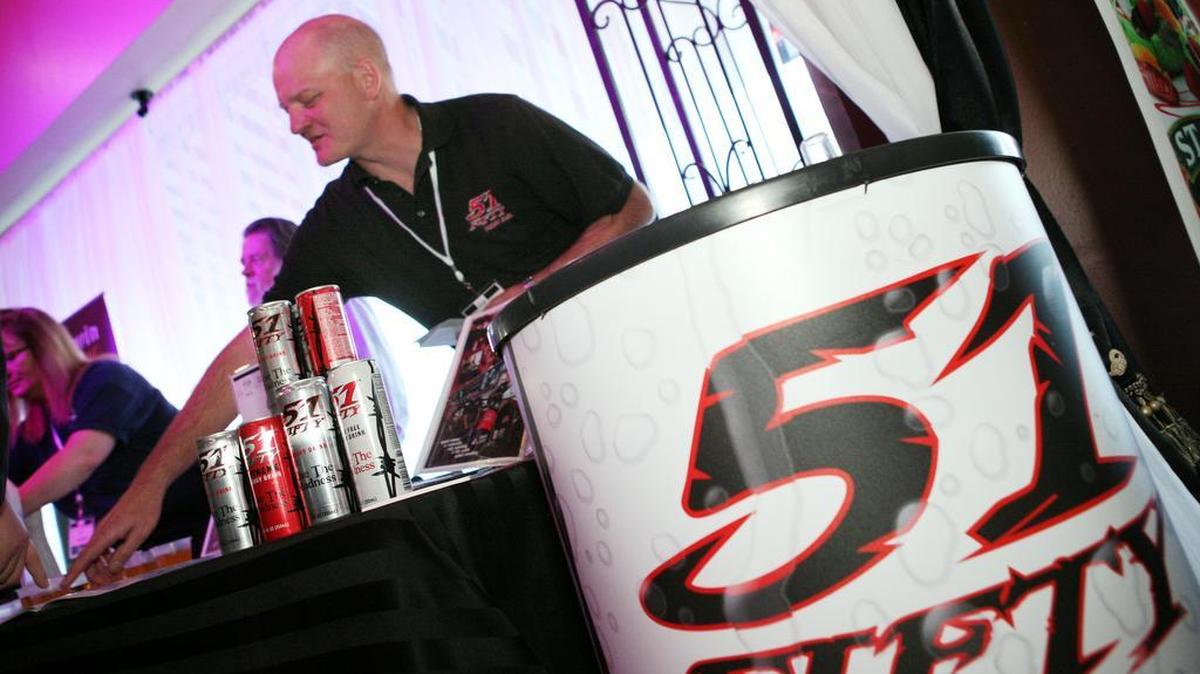 Dennis Kowalkowski of 51FIFTY energy drinks gives out information to visitors during the Fresno Food Expo new products/People’s Choice award event in Fresno, Calif., Feb. 28, 2013.