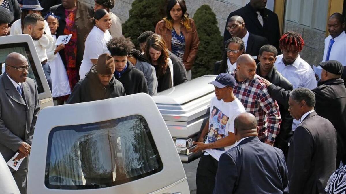 Pallbearers carry one of three caskets at the end of a joint memorial service for siblings Jerry Michael Shelton, 35, Brittany Powell, 27, and Chanetta Powell, 25, in Pittsburgh on March 22. The siblings were three of the six victims of a backyard massacre in Wilkinsburg, Pa. on March 9. Pittsburgh television station WTAE said Wednesday it has ended its relationship with anchorwoman Wendy Bell over racial comments she posted on Facebook about the shootings.