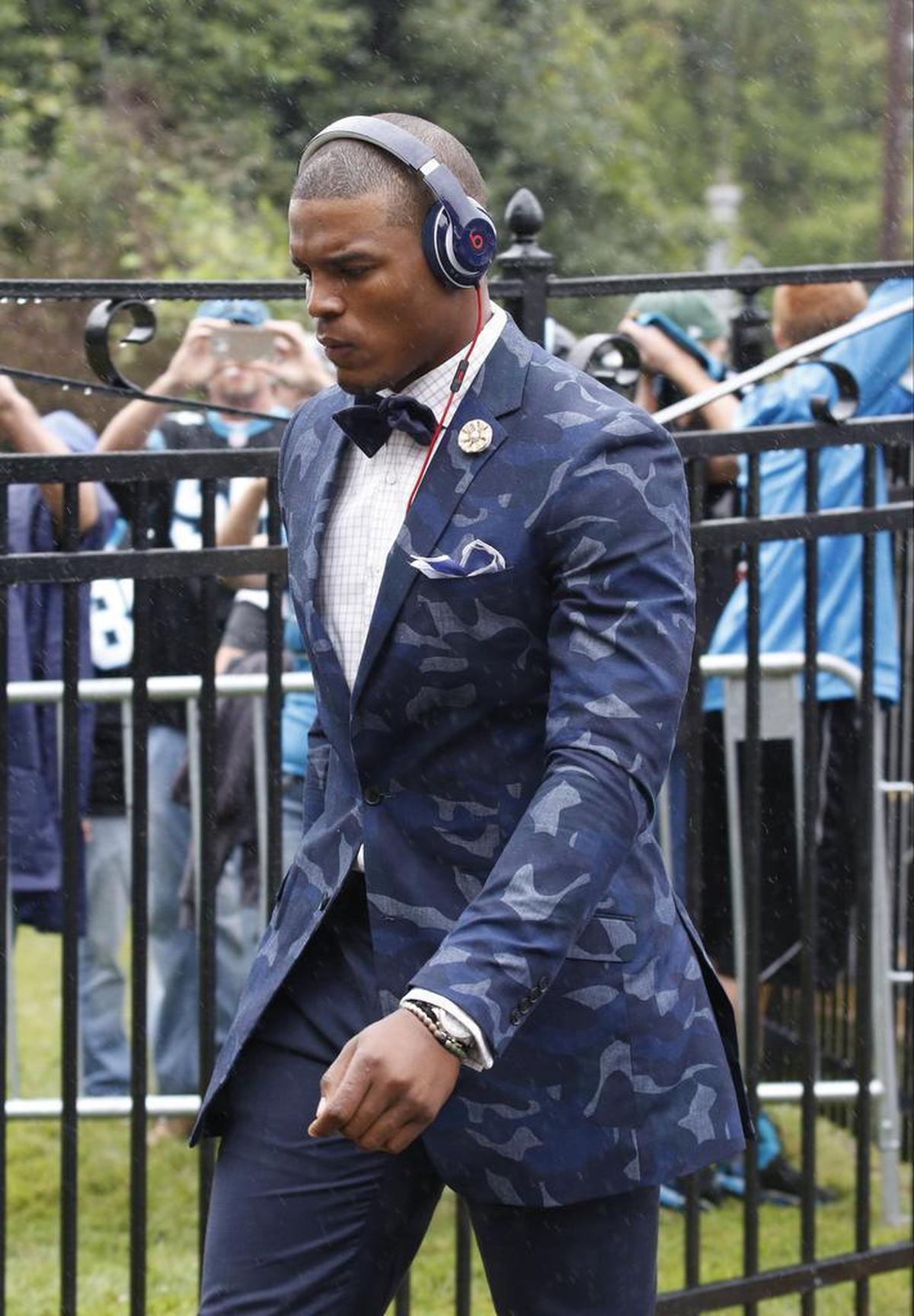 Carolina Panthers’ Cam Newton arrives at the stadium before an NFL football game between the Carolina Panthers and the New Orleans Saints in Charlotte, N.C., Sunday, Sept. 27, 2015.
