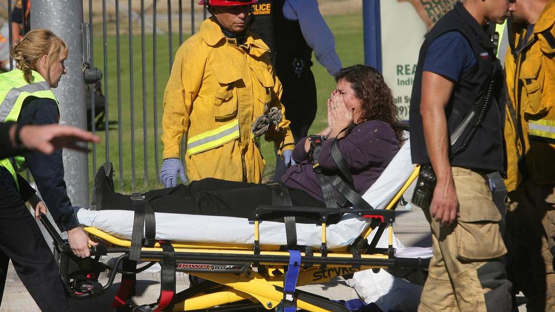 A victim is wheeled away on a stretcher following a shooting that killed multiple people at a social services facility, Wednesday, Dec. 2, 2015, in San Bernardino, Calif.