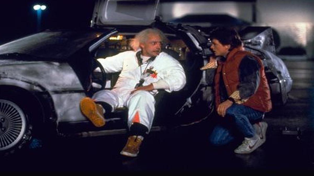 This photo provided by Universal Pictures Home Entertainment shows Christopher Lloyd, left, as Dr. Emmett Brown, and Michael J. Fox as Marty McFly in the 1985 film, "Back to the Future." Wednesday's so-called "Back to the Future" Day marks the date - Oct. 21, 2015 - that characters McFly, Brown and Jennifer Parker famously journeyed to the future in the film trilogy's second installment in 1989.