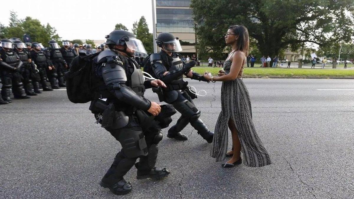 A demonstrator protesting the shooting death of Alton Sterling is detained by law enforcement in Baton Rouge on July 9, 2016.