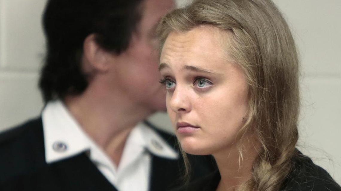 Michelle Carter listens to defense attorney Joseph P. Cataldo argue for an involuntary manslaughter charge against her to be dismissed at Juvenile Court in New Bedford, Mass., on Aug. 24, 2015.