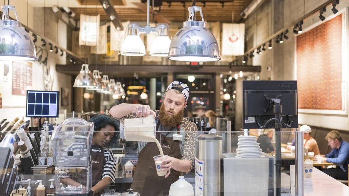 Spencer Young, assistant manager of a Peet’s Coffee, makes an iced Javiva blended beverage in San Francisco in 2015. As iced coffee spikes in popularity, with some coffee bars serving more drinks cold than hot, an onslaught of ready-made chilled coffees heads to grocery stores.