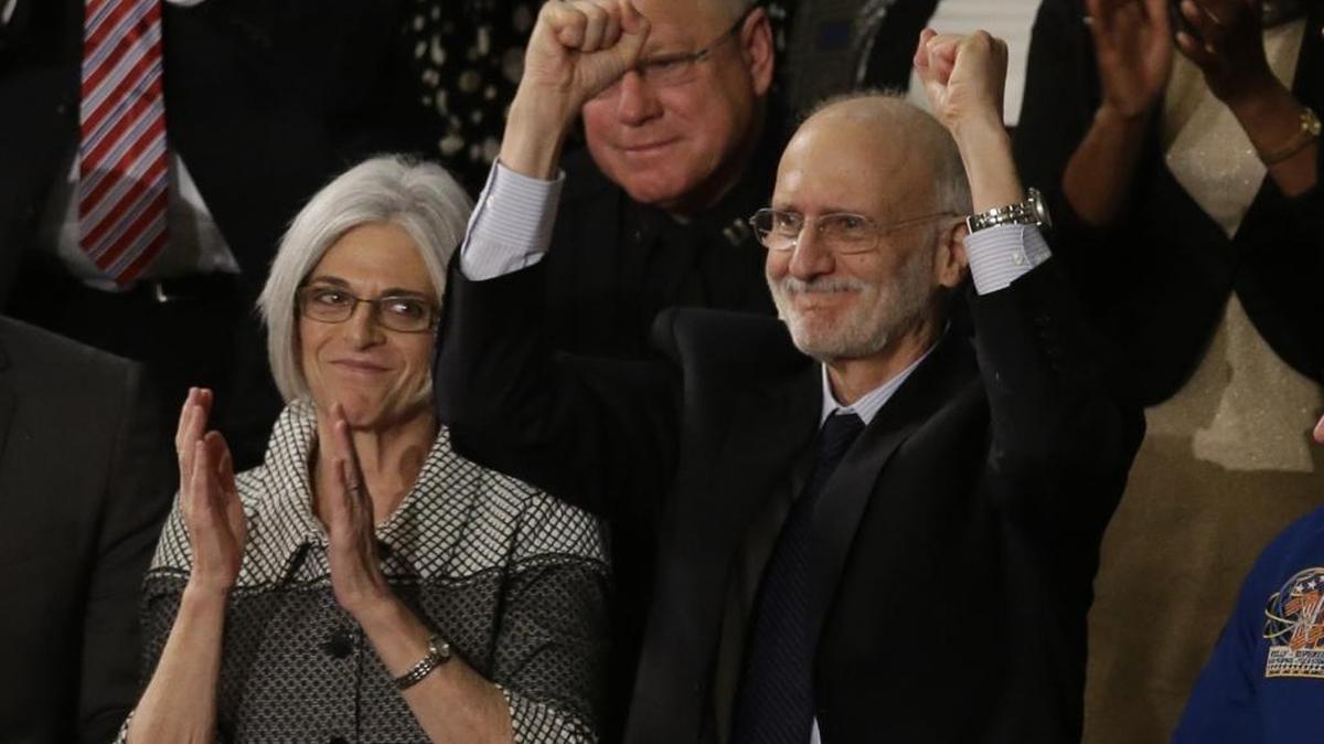 Alan Gross, accompanied by his wife Jusy, acknowledges applause on Capitol Hill in Washington, Tuesday, Jan. 20, 2015, during Presient Barack Obama's State of the Union address before a joint session of Congress.
