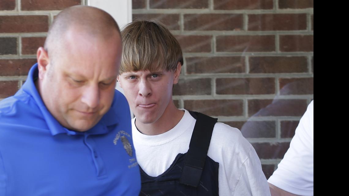 
Charleston, S.C., shooting suspect Dylann Storm Roof, center, is escorted from the Shelby Police Department in Shelby, N.C., Thursday, June 18, 2015. Roof is a suspect in the shooting of several people Wednesday night at the historic The Emanuel African Methodist Episcopal Church in Charleston, S.C. 
