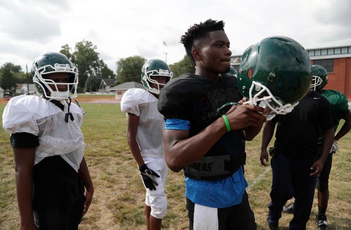 Madison High School quarterback Rhyheem Samuels gets ready to run through some drills.