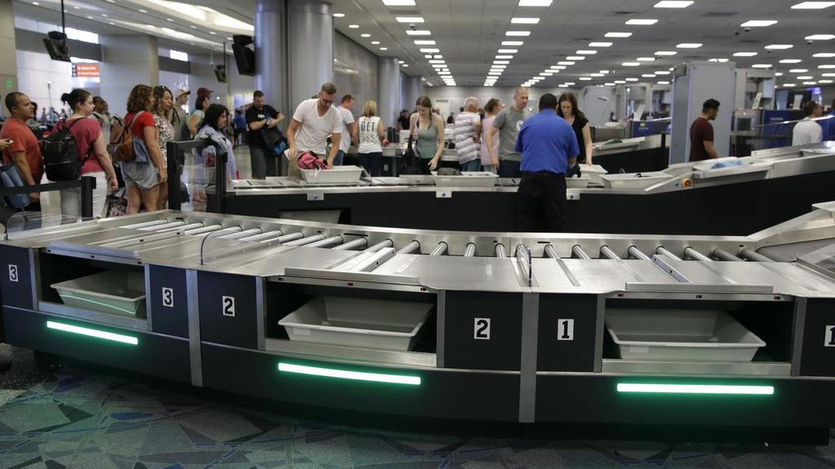 People use newly installed automated security lanes at McCarran International airport — one of the airports where an Oregon man made harassing calls, reporting family members as terrorists because they were invited to a family wedding and he wasn’t, according to court documents.