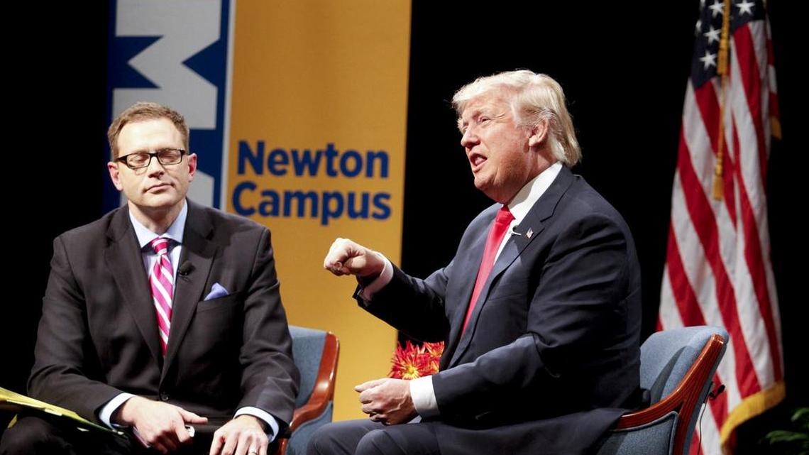 Republican presidential candidate Donald Trump speaks with host Dave Price during the WHO-HD Iowa Forums at Des Moines Area Community College on Thursday, Nov. 19, 2015, in Newton, Iowa.