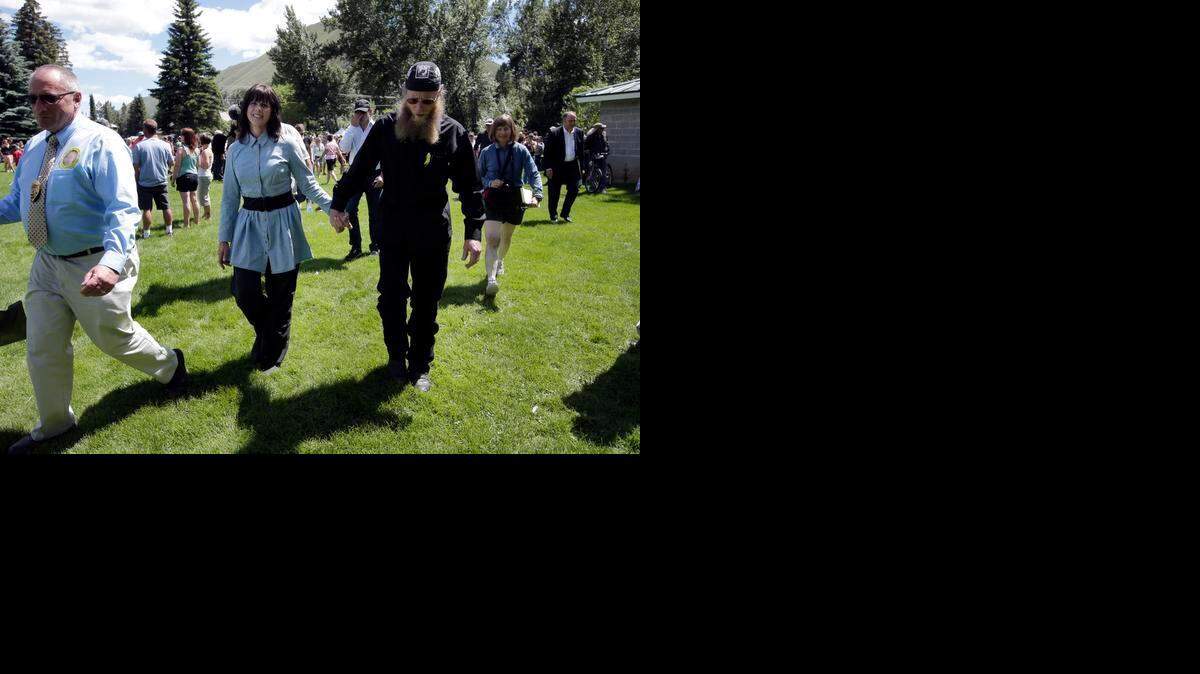 
In this June 22, 2013 file photo, U.S. Army Sgt. Bowe Bergdahl's parents Jani Bergdahl, center left, and her husband, Bob, walk during a "Bring Bowe Back" celebration held to honor Sgt. Bergdahl in Hailey, Idaho. A U.S. official says Bowe Bergdahl, who abandoned his post in Afghanistan and was held by the Taliban for five years, will be court martialed on charges of desertion and avoiding military service. 
