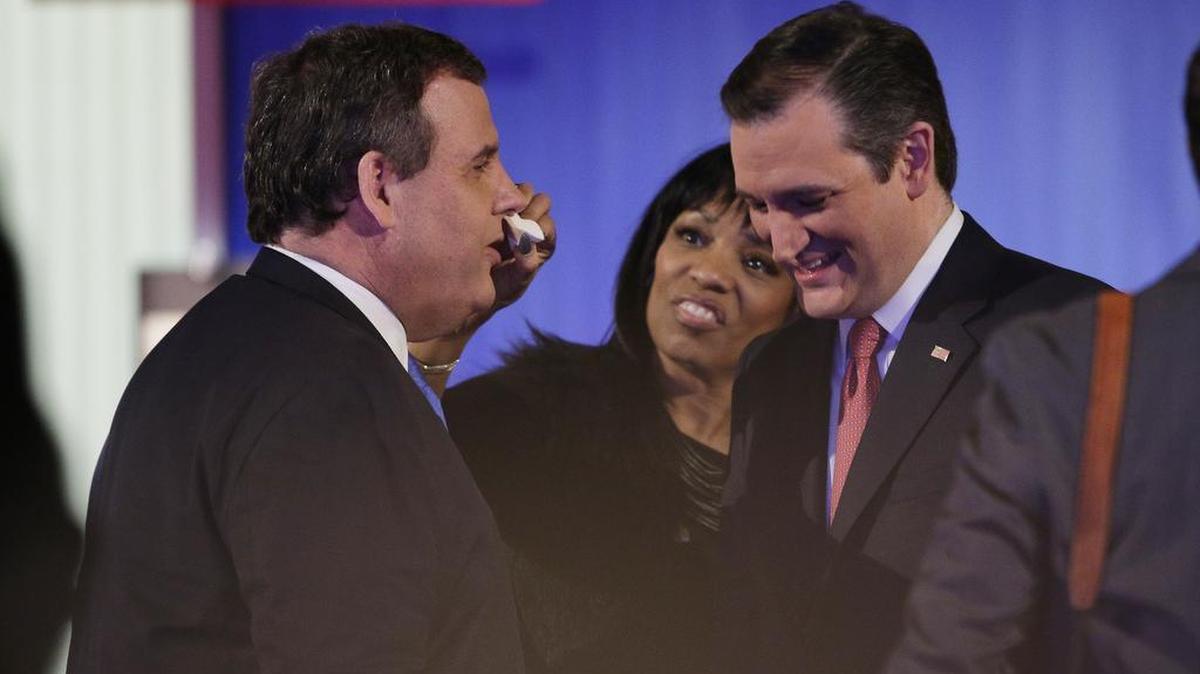 New Jersey Gov. Chris Christie, left, speaks with Sen. Ted Cruz, R-Texas, during a break at the Fox Business Network Republican presidential debate at the North Charleston Coliseum, Thursday, Jan. 14, 2016, in North Charleston, S.C.