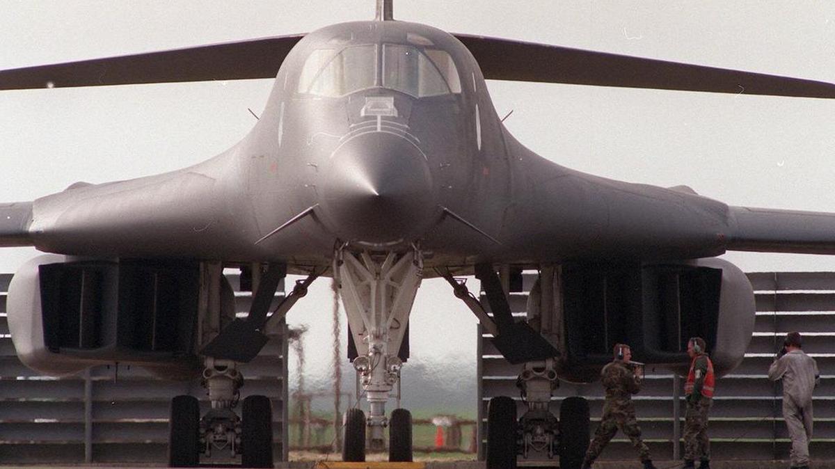 U.S. Air Force ground crew work underneath a B-1 bomber at R.A.F Fairford, England on Monday, April 5, 1999. The B-1 bomber has been in service since 1986.